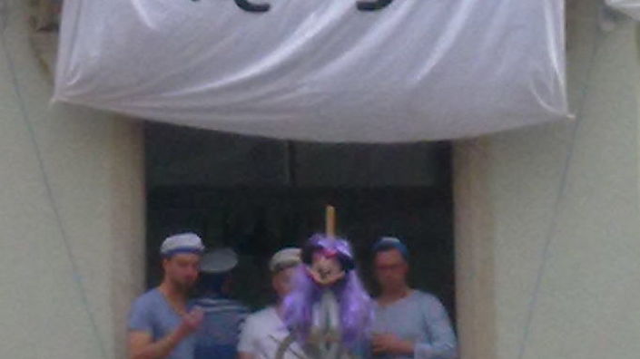 A balcony on Louisenstrasse with a different theme every year and the Mickey Mouse flag.