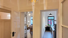 Family apartment - view from the hallway into the living room and kitchen